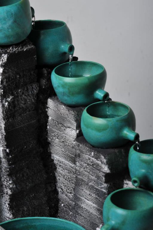 Green ceramic and foam fountain detail shot