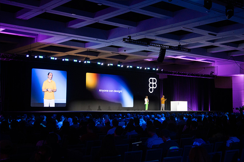 A photo of me speaking to the audience, with space and attendees in view