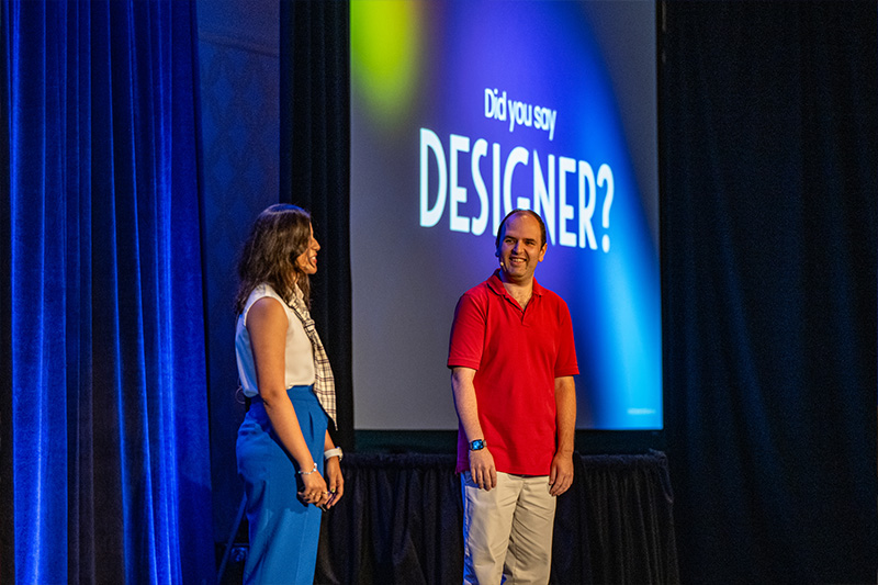 Ruchita and I speaking to the audience at Design Summit 2025