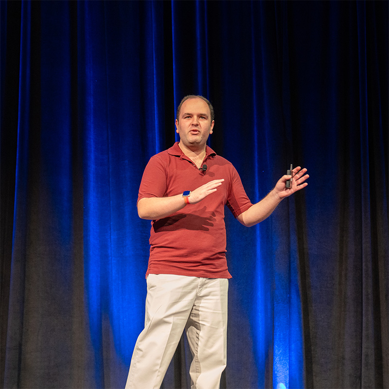 Rehan Butt speaking at UX Summit 2024