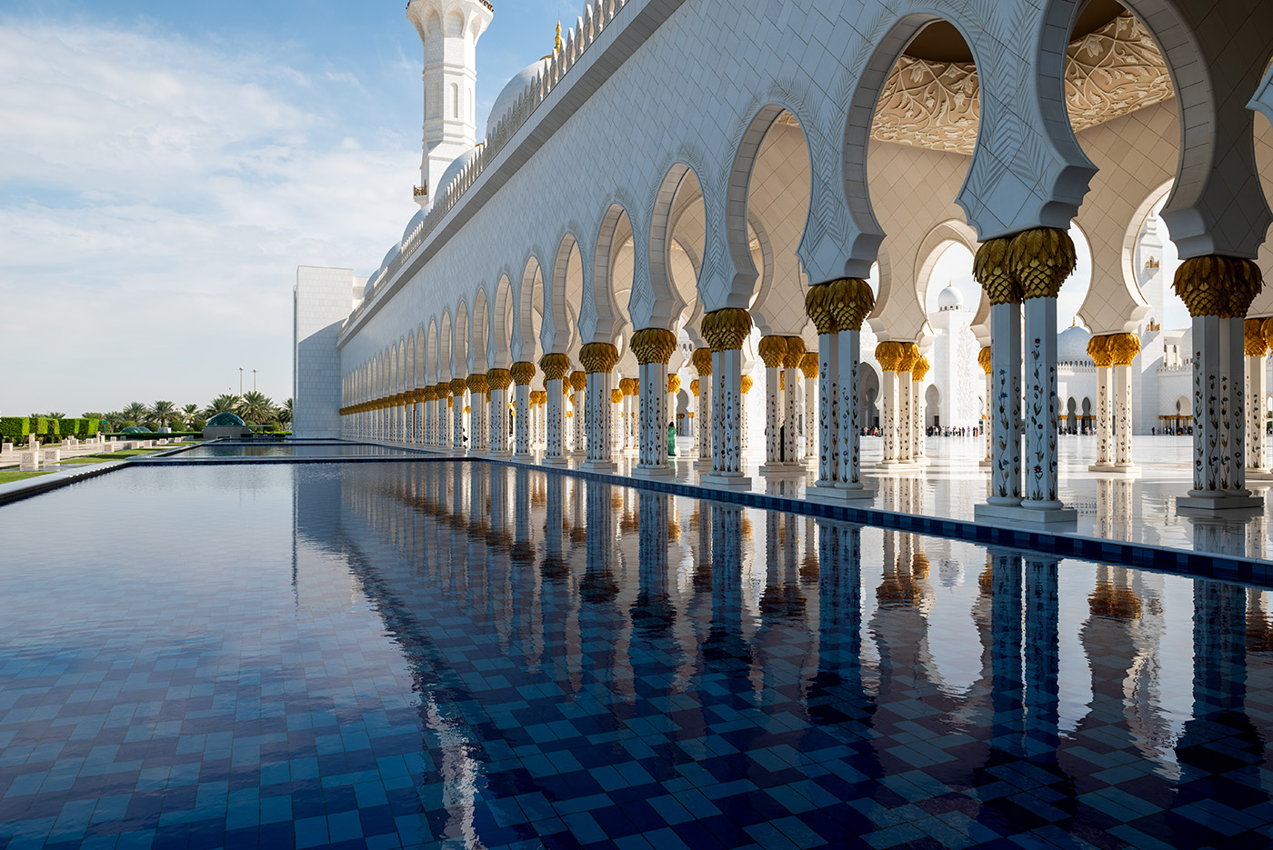 Sheikh Zayed Grand Mosque archway reflecting in the water