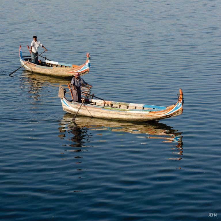 2 long river boats in Myanmar