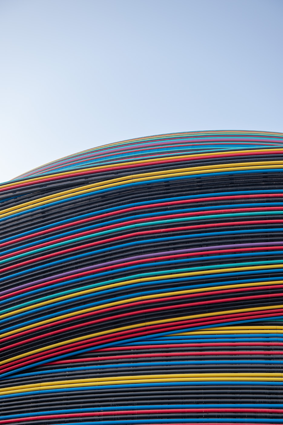 Colorful lines of the Russia pavilion against a blue sky