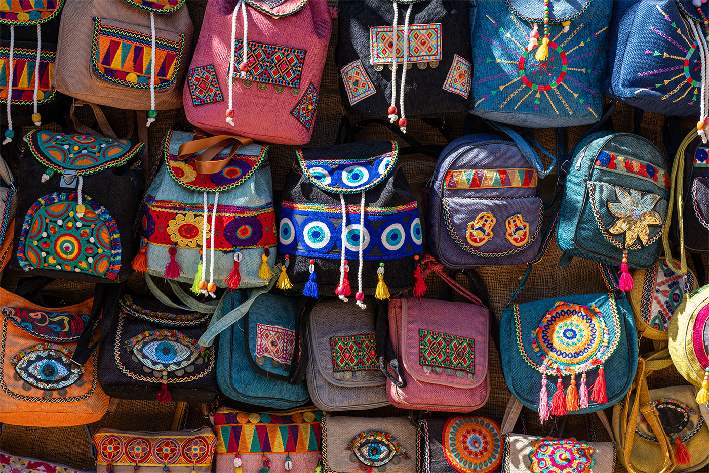 A wall of souvenir bags