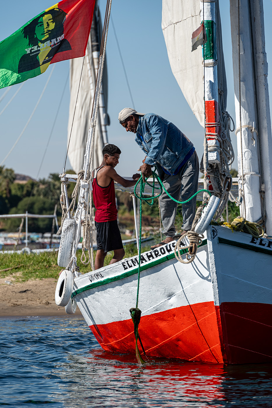 Two guys cleaning their boat