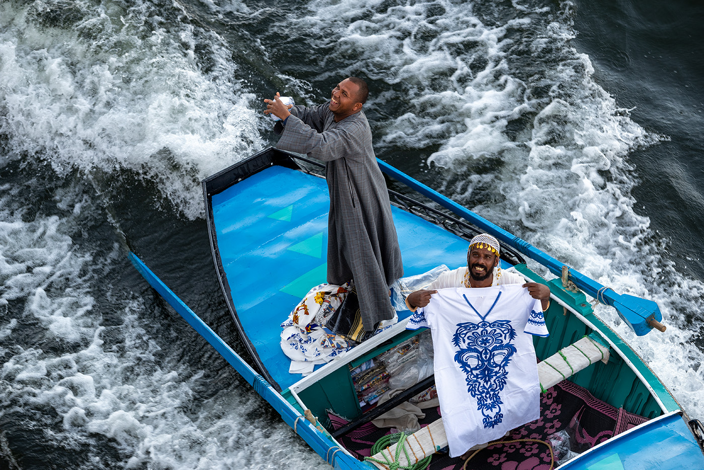 Salesmen selling clothing off their floating store