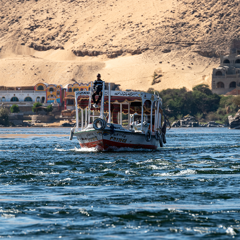 Ferry boat with someone sitting on ladder