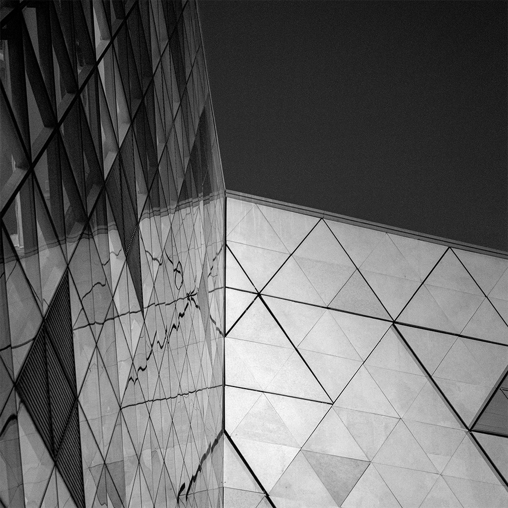 Black and white architectural image of the corner of the Grand Egyptian Museum