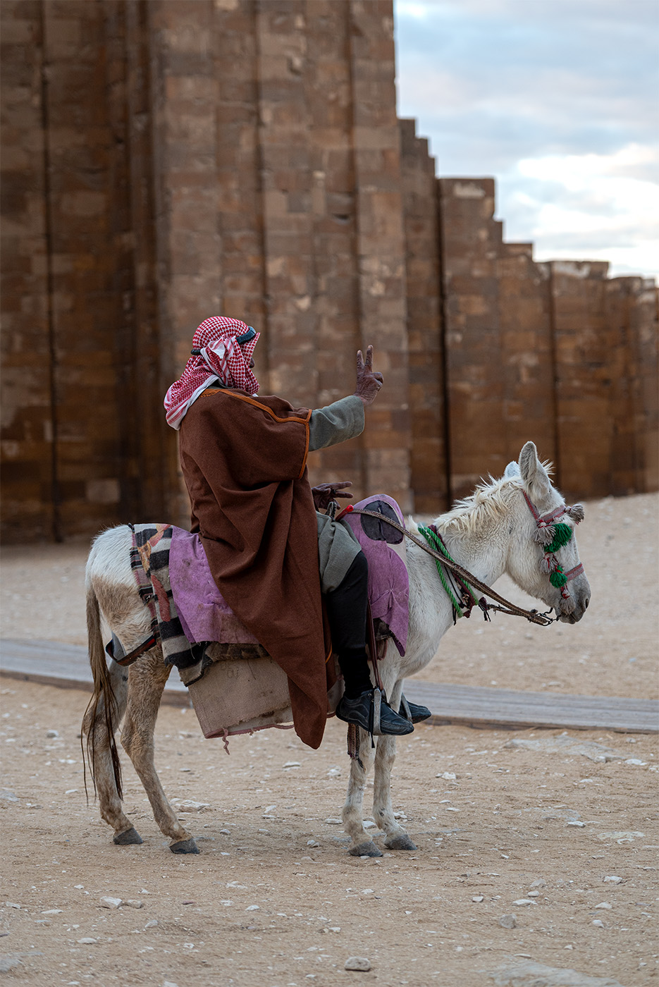 Peace sign on horse back