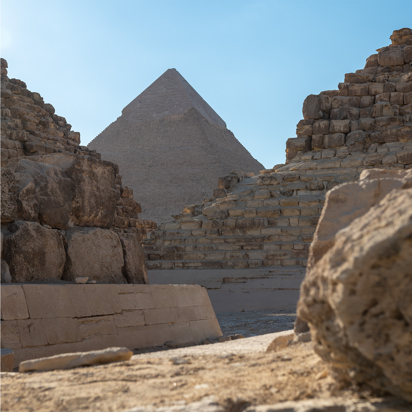 Pyramid of Giza through the ruins of adjacent structures