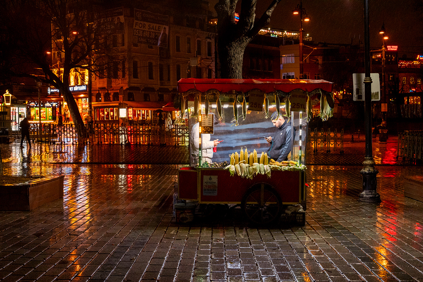 Roasted corn cart in a wet evening