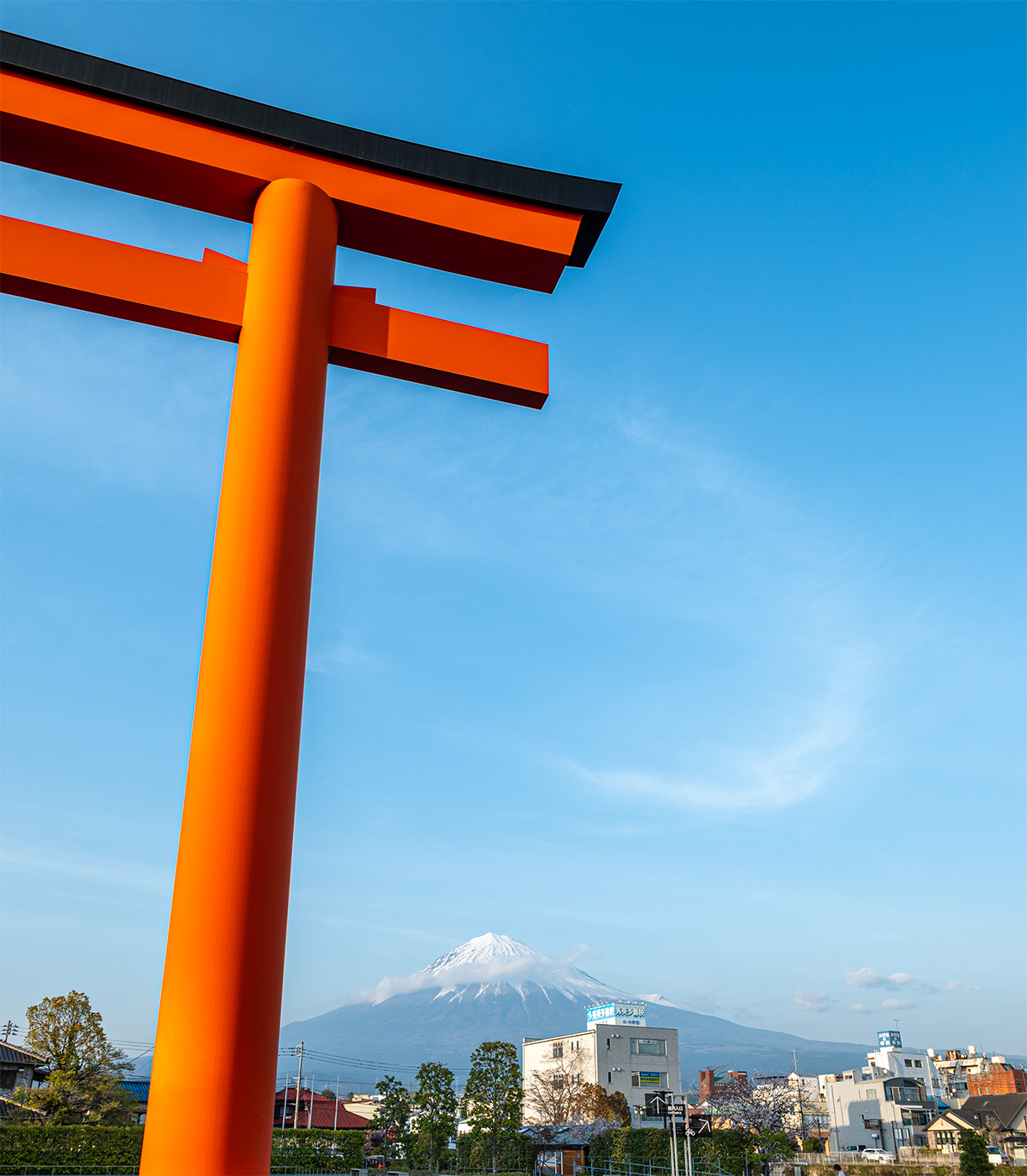 Tori gate with Mount Fuji and a dramatic sky