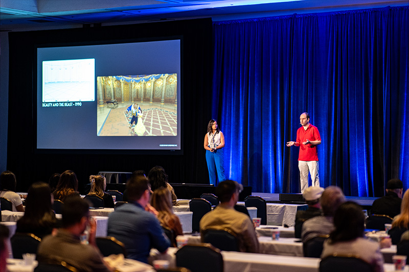 A photo of me speaking to the audience, with space and attendees in view